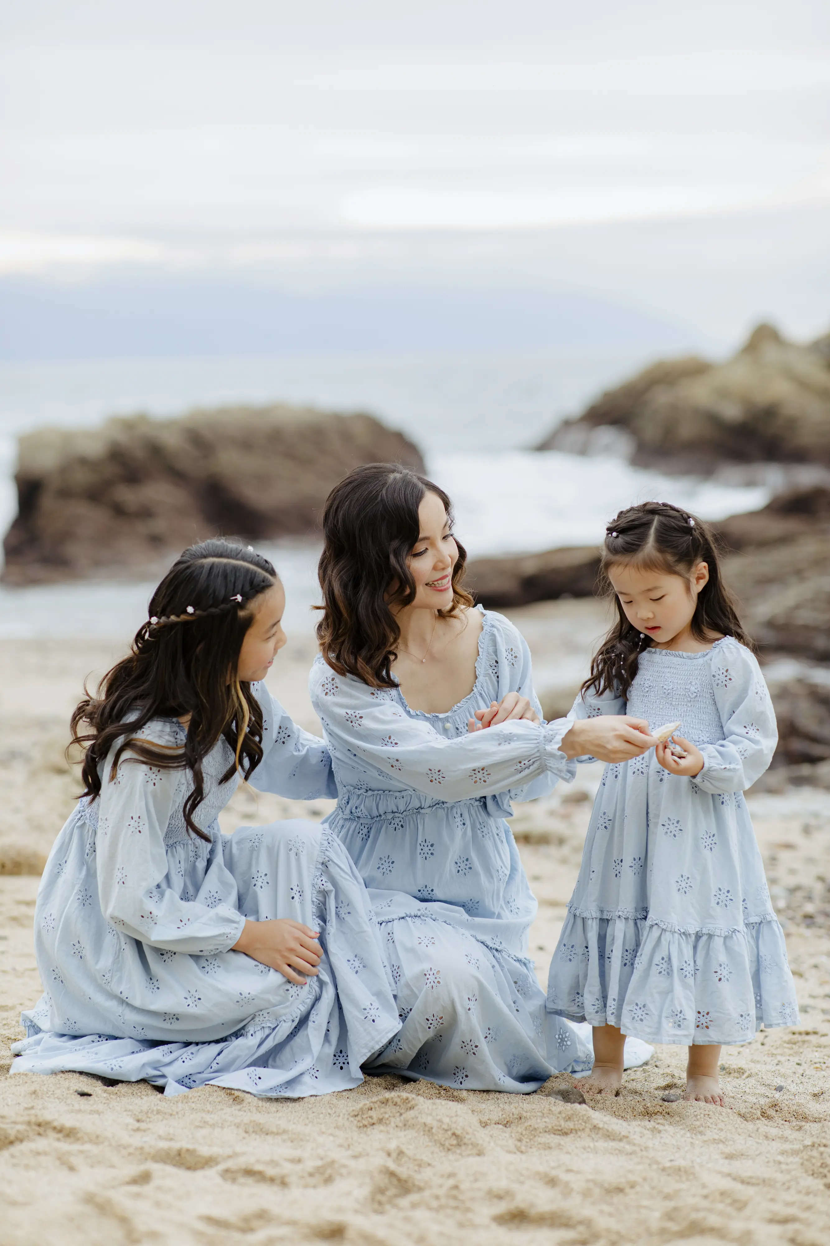 Mother and two daughters in matching dresses on Conchas Chinas Beach Puerto Vallarta