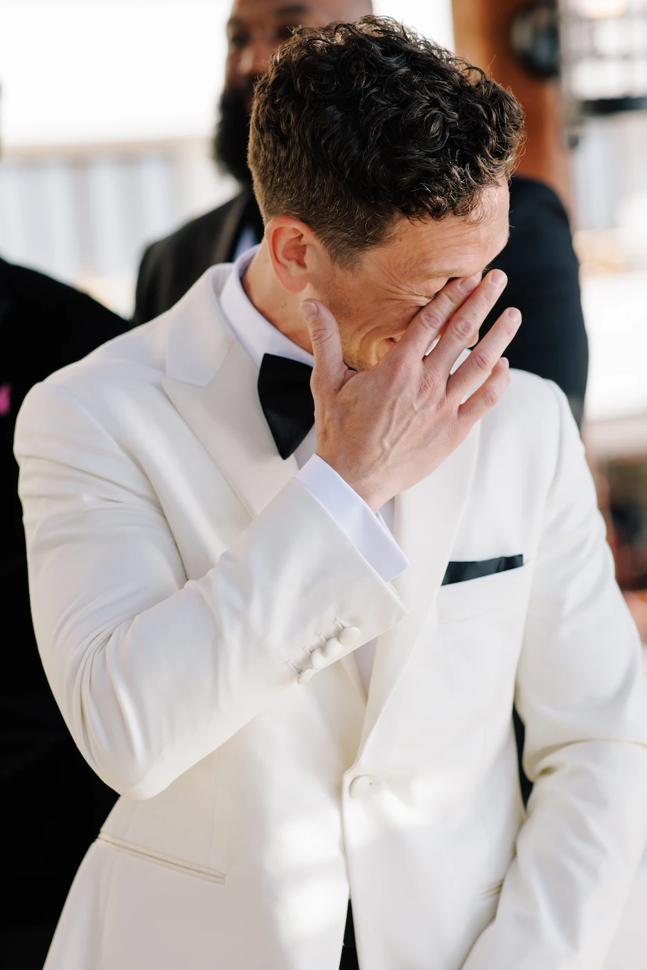 Groom overcome with emotion wiping tears at wedding ceremony Puerto Vallarta