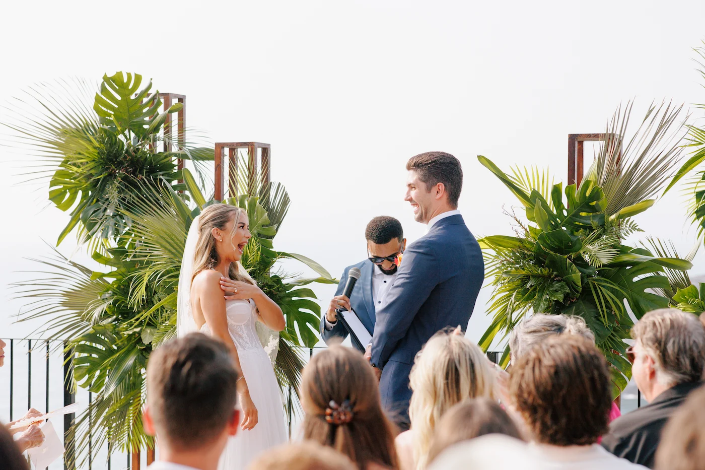 Jessie and Colin intimate wedding ceremony with tropical palms at private villa Puerto Vallarta